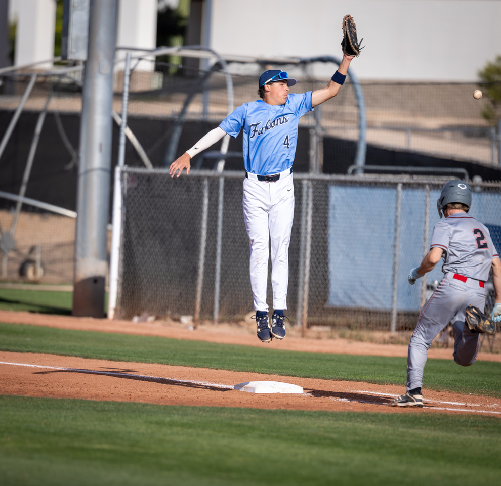 Matthew Bauer stretching for a catch at first base